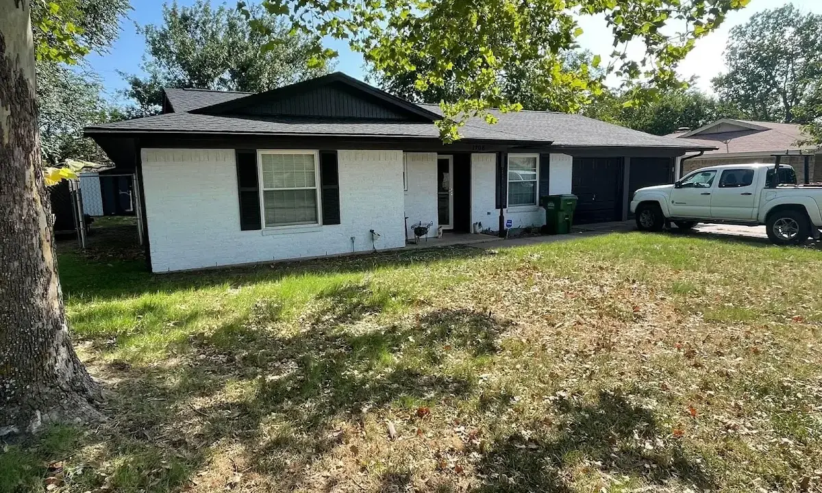 Professional roofing crew working on a residential roof in New Brunswick